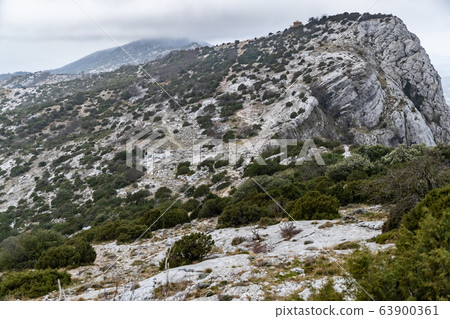 The mountain over grotto of Mary Magdalene at cloudy weather, clouds over a valley, a dry grass The mountain over grotto of Mary Magdalene at cloudy weather, clouds over a valley, a dry grass 63900361