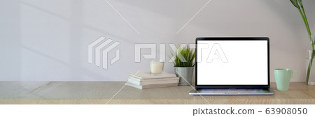 Cropped shot of simple workspace with blank screen Cropped shot of simple workspace with blank screen 63908050