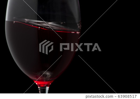 Wine copy space swaying in a glass Wine copy space swaying in a glass 63908517