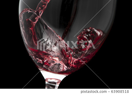 Pour the wine into the glass Pour the wine into the glass 63908518