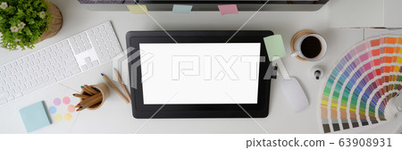 Overhead shot of graphic designer office desk with 63908931