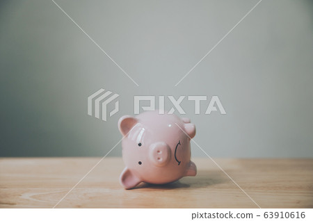 Piggy bank on wood table. Financial investment and save money concept 63910616