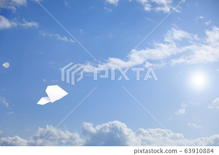 Paper airplane flying in the sky 63910884