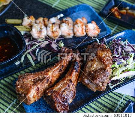 Grilled pork with salad 63911913