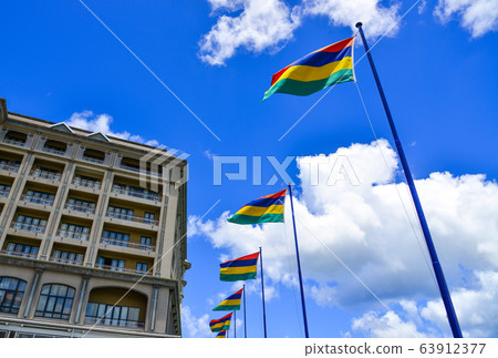 National flags waving under blue sky 63912377