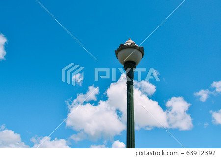 Lamp post against the blue sky 63912392