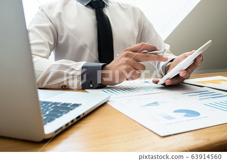 business leader woman analyzing the charts and graphs for planning management new project 63914560