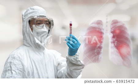 COVID-19 Coronavirus Novel corona virus epidemic lung infection disease doctor in PPE blood tube 63915472