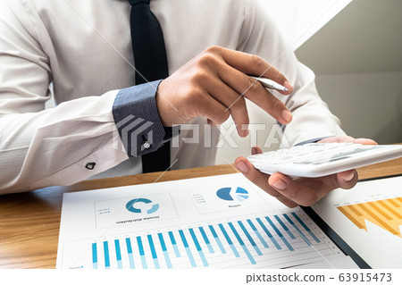 business leader woman analyzing the charts and graphs for planning management new project 63915473
