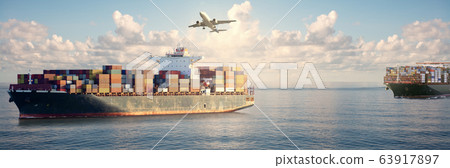 Mighty container ships in ocean at sunrise 63917897