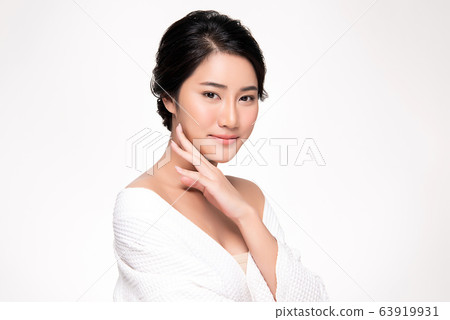 Beautiful Young Asian Woman with Clean Fresh Skin. Face care, Facial treatment, Cosmetology, beauty Beautiful Young Asian Woman with Clean Fresh Skin. Face care, Facial treatment, Cosmetology, beauty 63919931