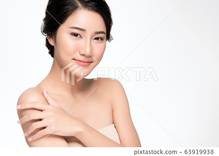 Beautiful Young Asian Woman with Clean Fresh Skin. Face care, Facial treatment, Cosmetology, beauty Beautiful Young Asian Woman with Clean Fresh Skin. Face care, Facial treatment, Cosmetology, beauty 63919938