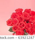 Bouquet of red roses on pink background 63921287