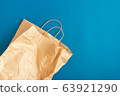 Crumpled Paper bag on a blue background 63921290