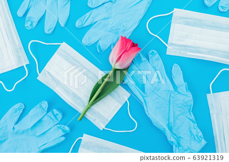 Medical masks for protection from virus and bacteria on a blue background. Flat lay. Top view 63921319