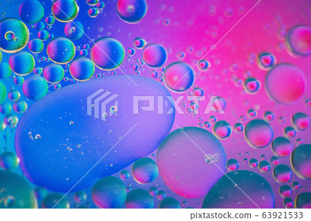 Defocused pink and blue abstract background picture made with oil, water and soap Defocused pink and blue abstract background picture made with oil, water and soap 63921533