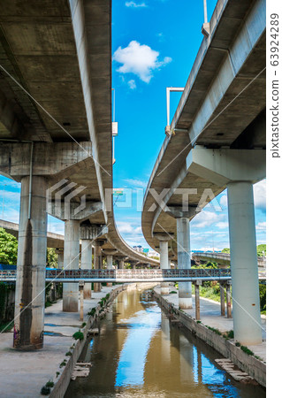 Bottom view overhead railway in a modern city. Bottom view overhead railway in a modern city. 63924289