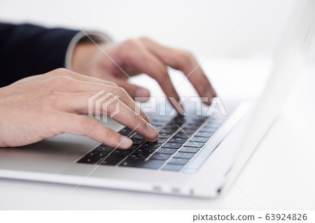 Japanese male businessman typing on laptop 63924826