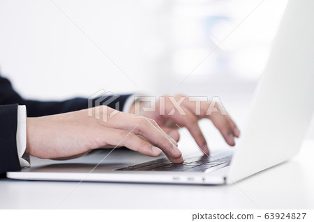 Japanese male businessman typing on laptop 63924827