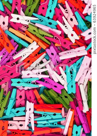 Colorful Wooden clothespins close-up as texture 63924965