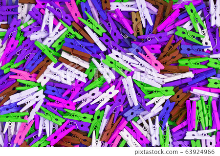 Colorful Wooden clothespins close-up as texture 63924966