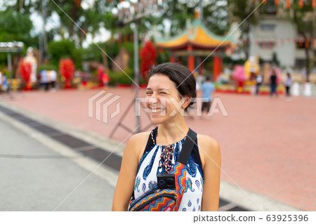 Beautiful european girl tourist walks in a Chinese Beautiful european girl tourist walks in a Chinese 63925396