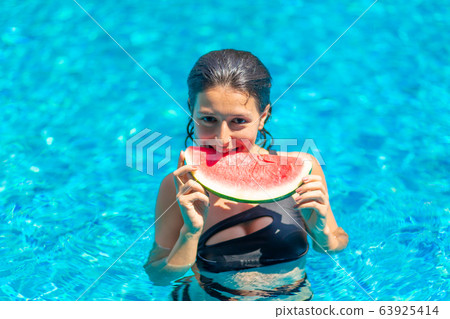 Sexy young brunette woman with juicy watermelon in Sexy young brunette woman with juicy watermelon in 63925414