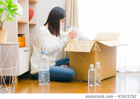 PET bottle drinking water, cardboard, out, out PET bottle drinking water, cardboard, out, out 63925782