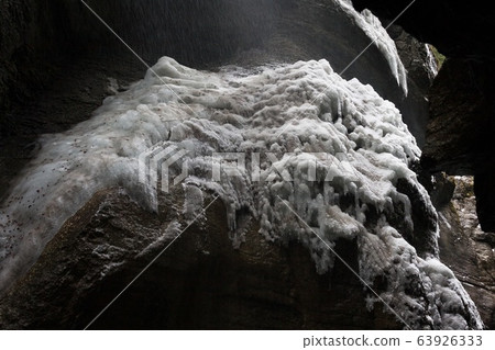 Snow-covered icicles at Partnachklamm, famous tourist destination. Partnachklamm in Garmisch-Partenkirchen, Bavaria, Germany 63926333