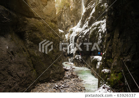 Snow-covered icicles at Partnachklamm, famous tourist destination. Partnachklamm in Garmisch-Partenkirchen, Bavaria, Germany 63926337