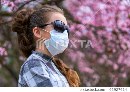 girl with a face mask is in the city outdoor, girl with a face mask is in the city outdoor, 63927614