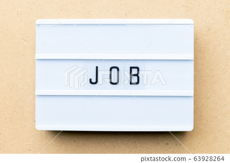 White lightbox with word job on wood background 63928264