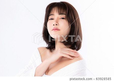 Beautiful Young Asian Woman with Clean Fresh Skin. Face care, Facial treatment, Cosmetology, beauty Beautiful Young Asian Woman with Clean Fresh Skin. Face care, Facial treatment, Cosmetology, beauty 63928585