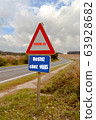 Covid-19 road sign, stay at home against 63928682