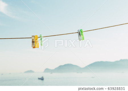 Colorful clothes pegs with sea at Huinnyeoul Culture Village in Busan, Korea 63928831