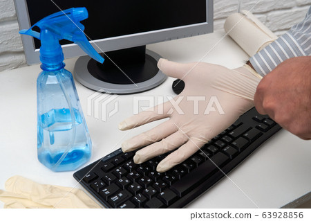 concept of cleaning or disinfecting the office - a concept of cleaning or disinfecting the office - a 63928856