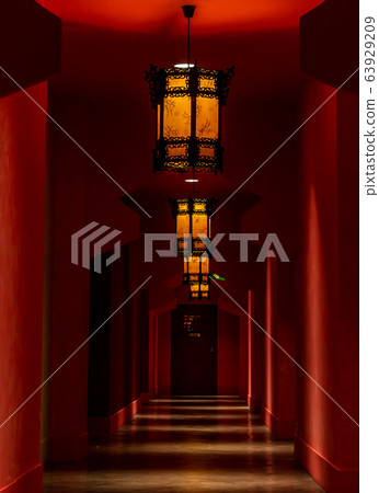 Chinese style hotel corridor with many doors. Chinese style hotel corridor with many doors. 63929209