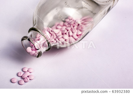 Pills in bottle on white background. Drugs, painkillers, colds and other medicines. Pills in bottle on white background. Drugs, painkillers, colds and other medicines. 63932380