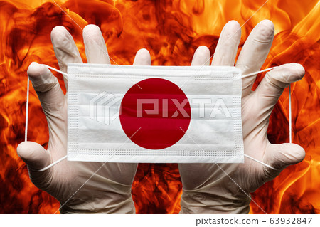 Doctor holding in white gloves protection medical face mask, respiratory bandage with Japan national country flag superimposed on mask. Concept Doctor holding in white gloves protection medical face mask, respiratory bandage with Japan national country flag superimposed on mask. Concept 63932847