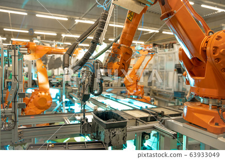 Detail of a robotic arm in a factory, auto industry Detail of a robotic arm in a factory, auto industry 63933049