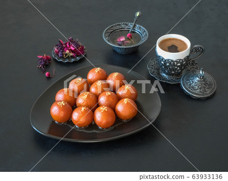 Gulab Jamun - Traditional Indian sweets on a black Gulab Jamun - Traditional Indian sweets on a black 63933136