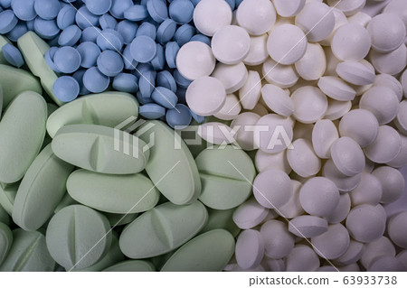 pills lie on table macro. Drugs, painkillers, colds and other medicines. pills lie on table macro. Drugs, painkillers, colds and other medicines. 63933738