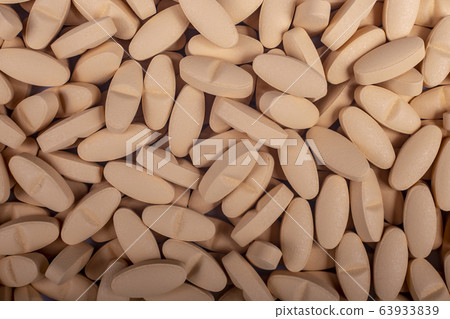 pills lie on table background Drugs, painkillers, colds and other cures close-up 63933839