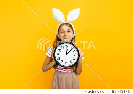 Happy beautiful girl on her head with rabbit ears, 63935488