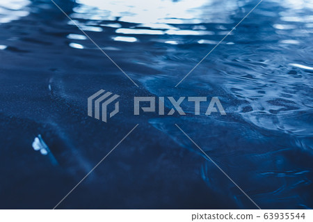 dark blue colored calm wavy water surface texture dark blue colored calm wavy water surface texture 63935544