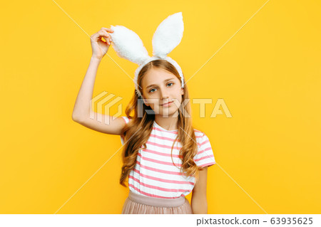 Happy little beautiful girl on her head with Happy little beautiful girl on her head with 63935625
