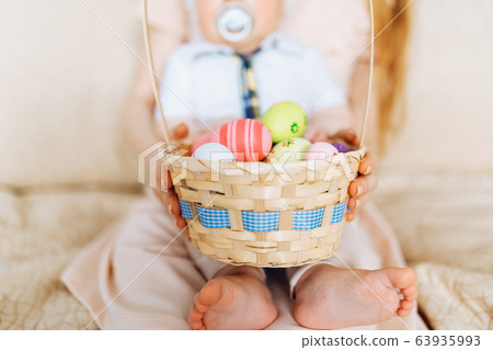 Happy Easter. Close-up of a happy mother and small 63935993