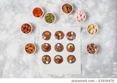 Handmade chocolate mediants, cookies, bites, candies,nuts. Copy space. Top view. Handmade chocolate mediants, cookies, bites, candies,nuts. Copy space. Top view. 63936476