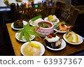 Authentic Japanese food served with floral garnish. 63937367