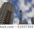 Buildings and motion blurred clouds in Kobe, Japan. 63937369